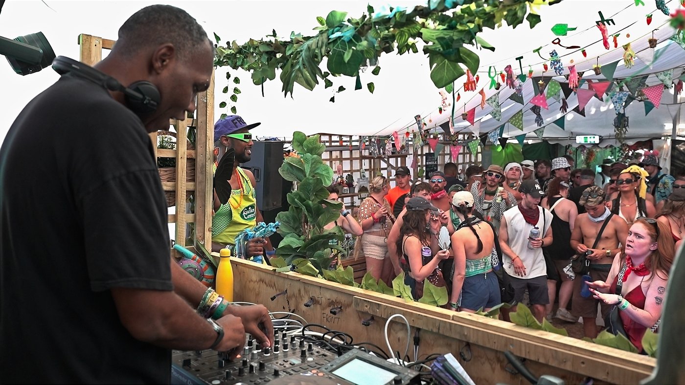 Rodderz on the decks with the crowd at Boomtown Fair Garden Centre Stage 2026