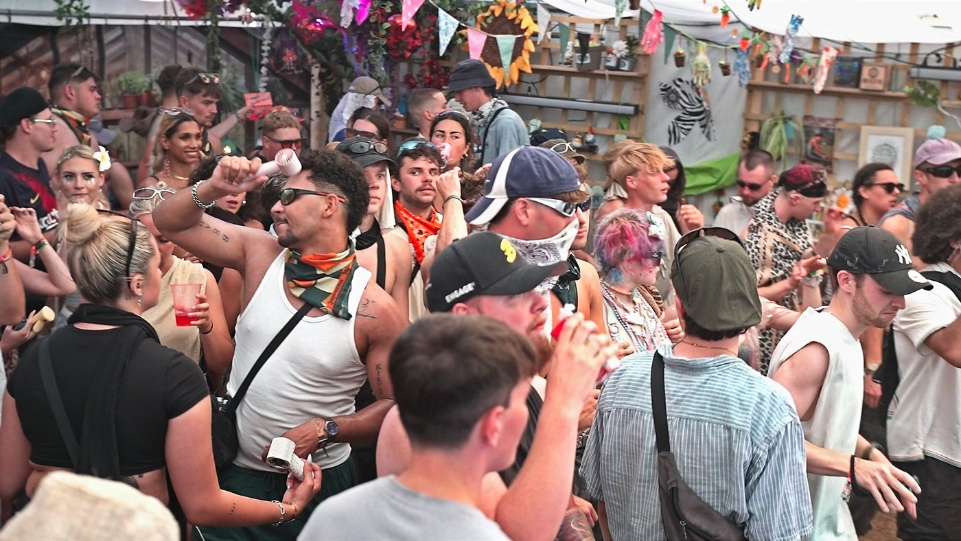 Crowd dancing at Boomtown Fair Garden Centre Stage 2026